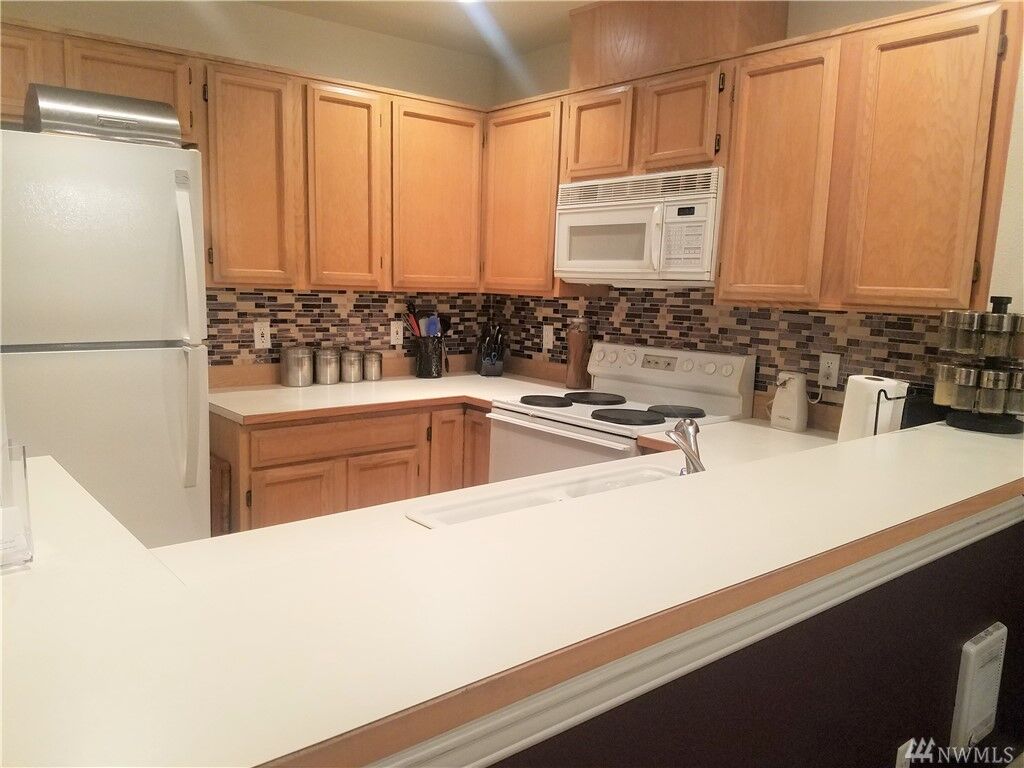 Property Photo:  6716 S 238th Place G106  WA 98032 