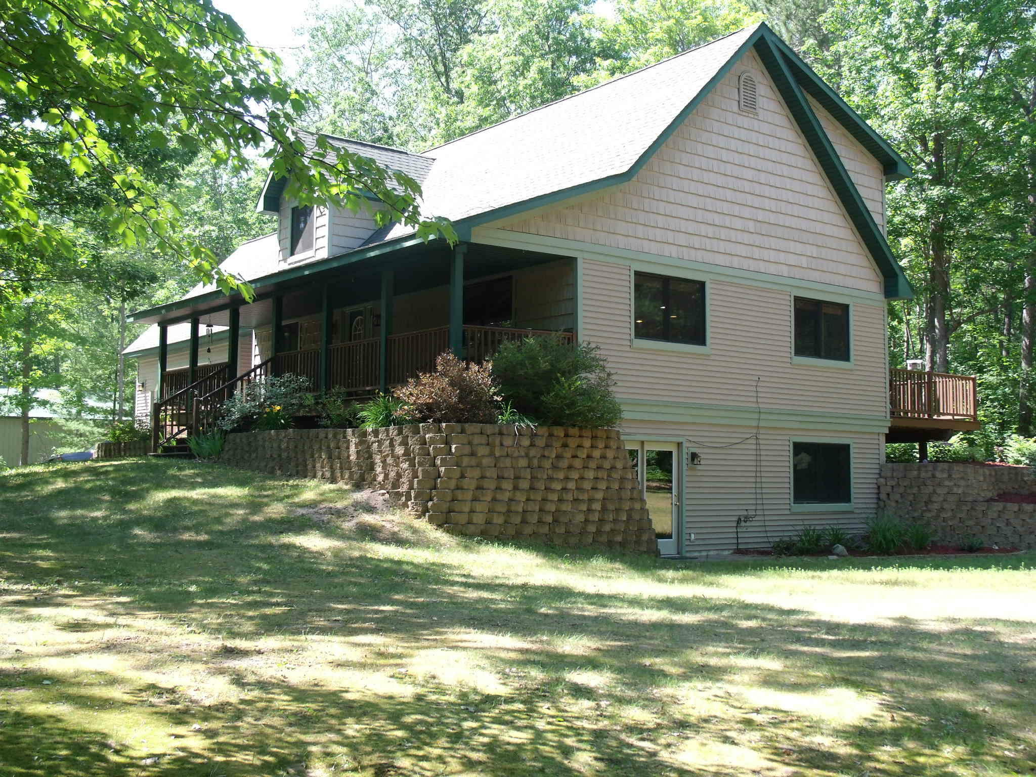 Property Photo:  5880 Woodland Drive  MI 49749 