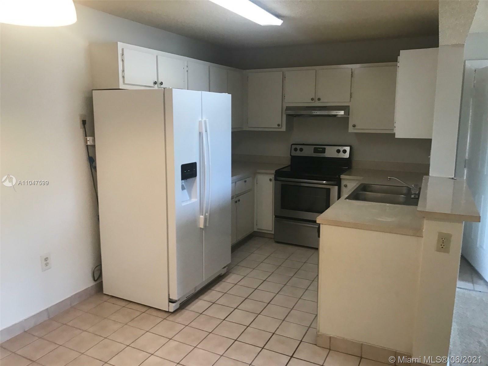 Property Photo:  300 W Palm Cir W 205  FL 33025 