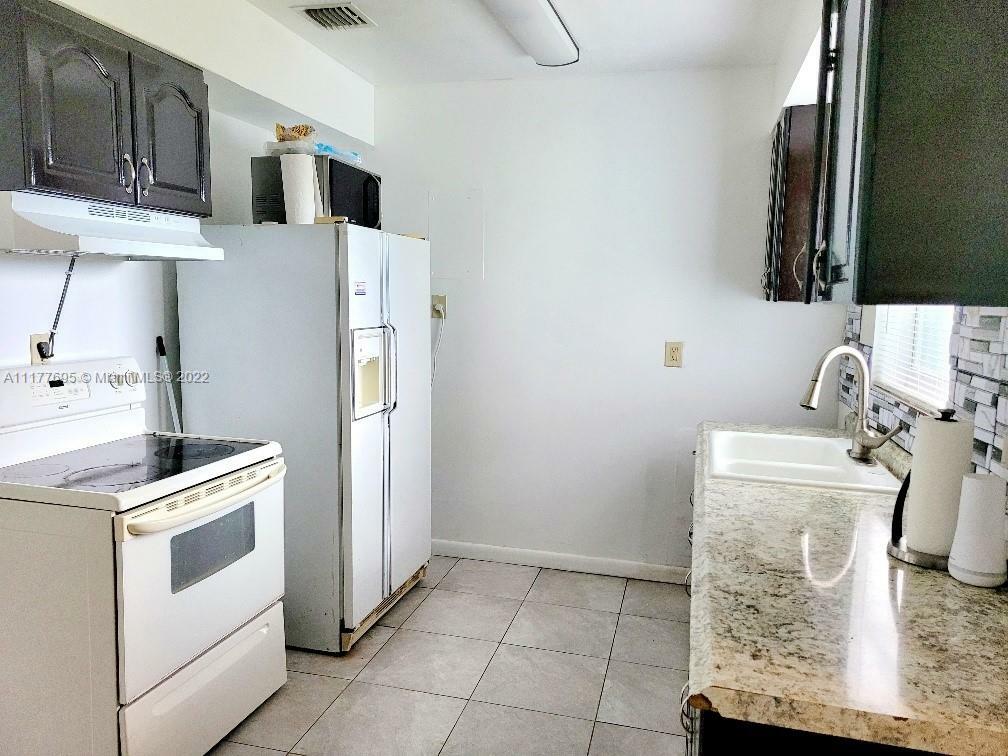 Property Photo:  1200 NW 11th Ct  FL 33311 