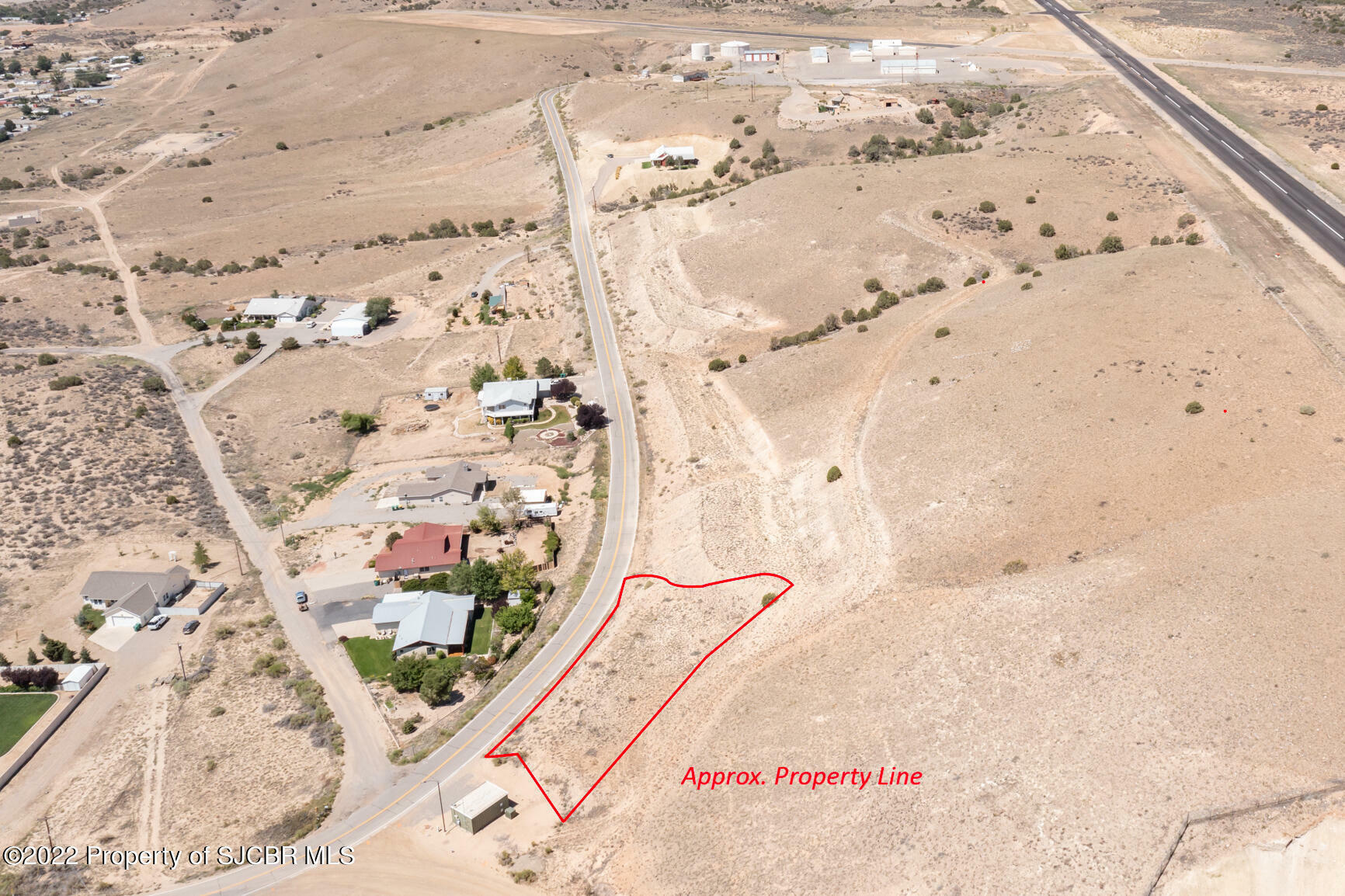 Property Photo:  703 Airport Drive  NM 87410 