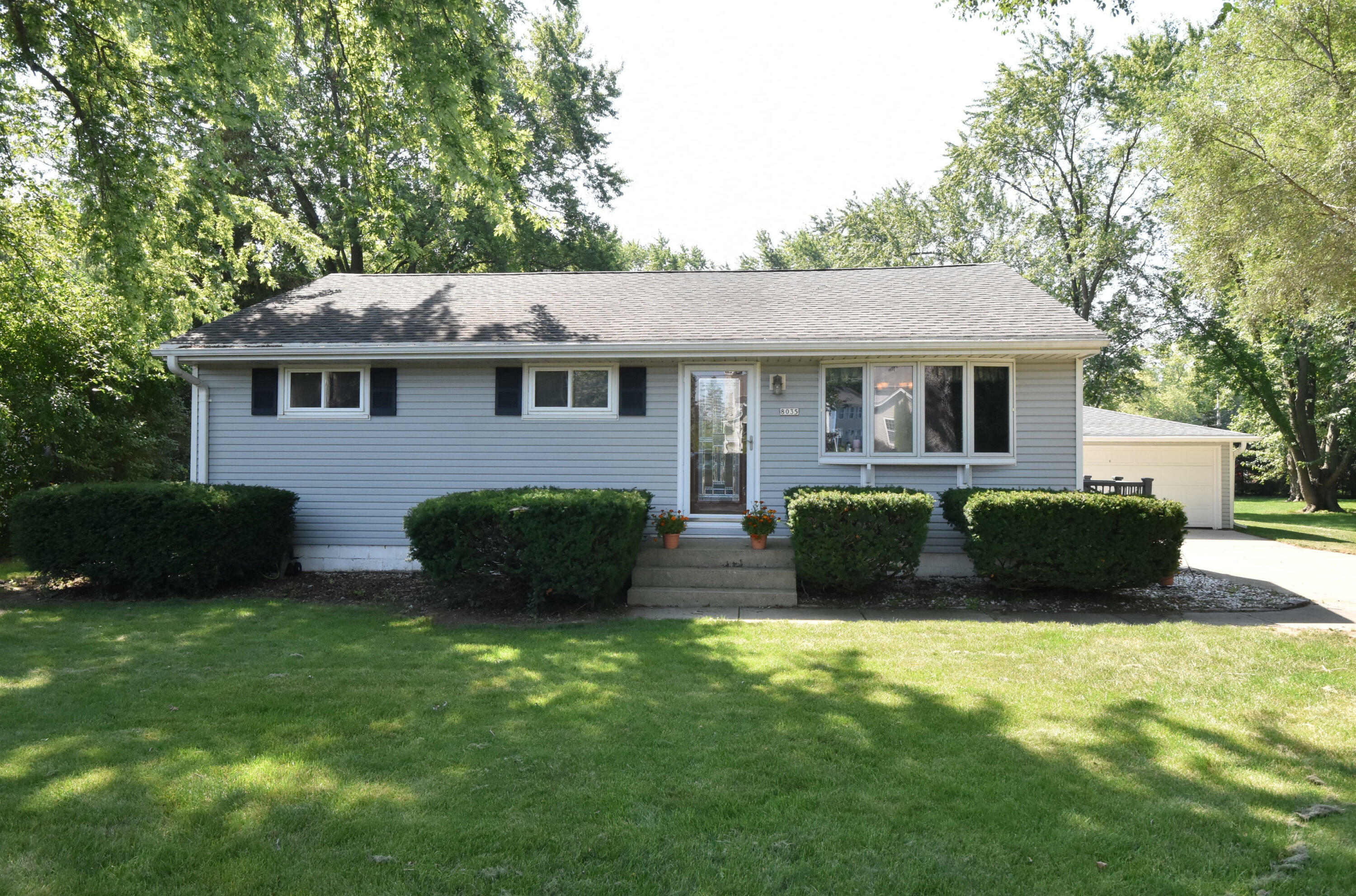 Property Photo:  8035 W Puetz Rd  WI 53132 