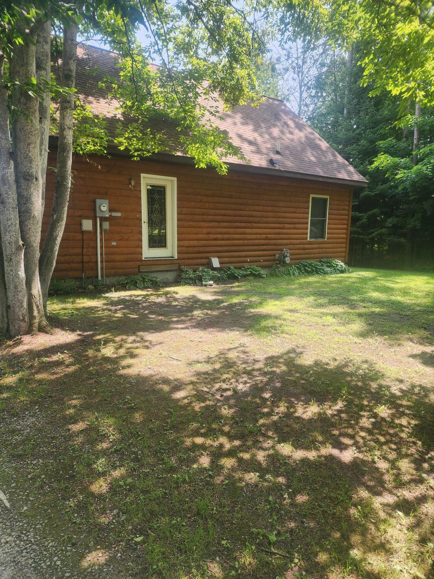 Property Photo:  217 Cedarwood  MI 49753 