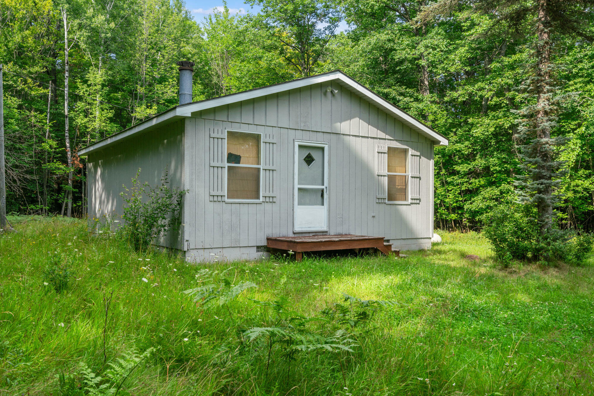 Property Photo:  4280 Woodmansee Road  MI 49721 