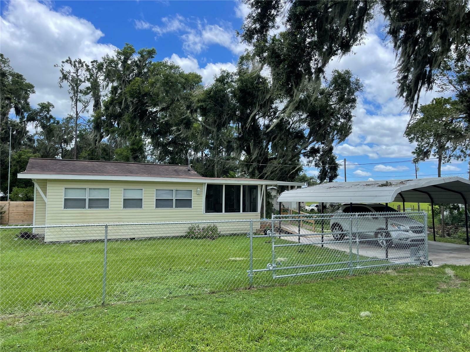 Property Photo:  1217 County Road 464  FL 33538 