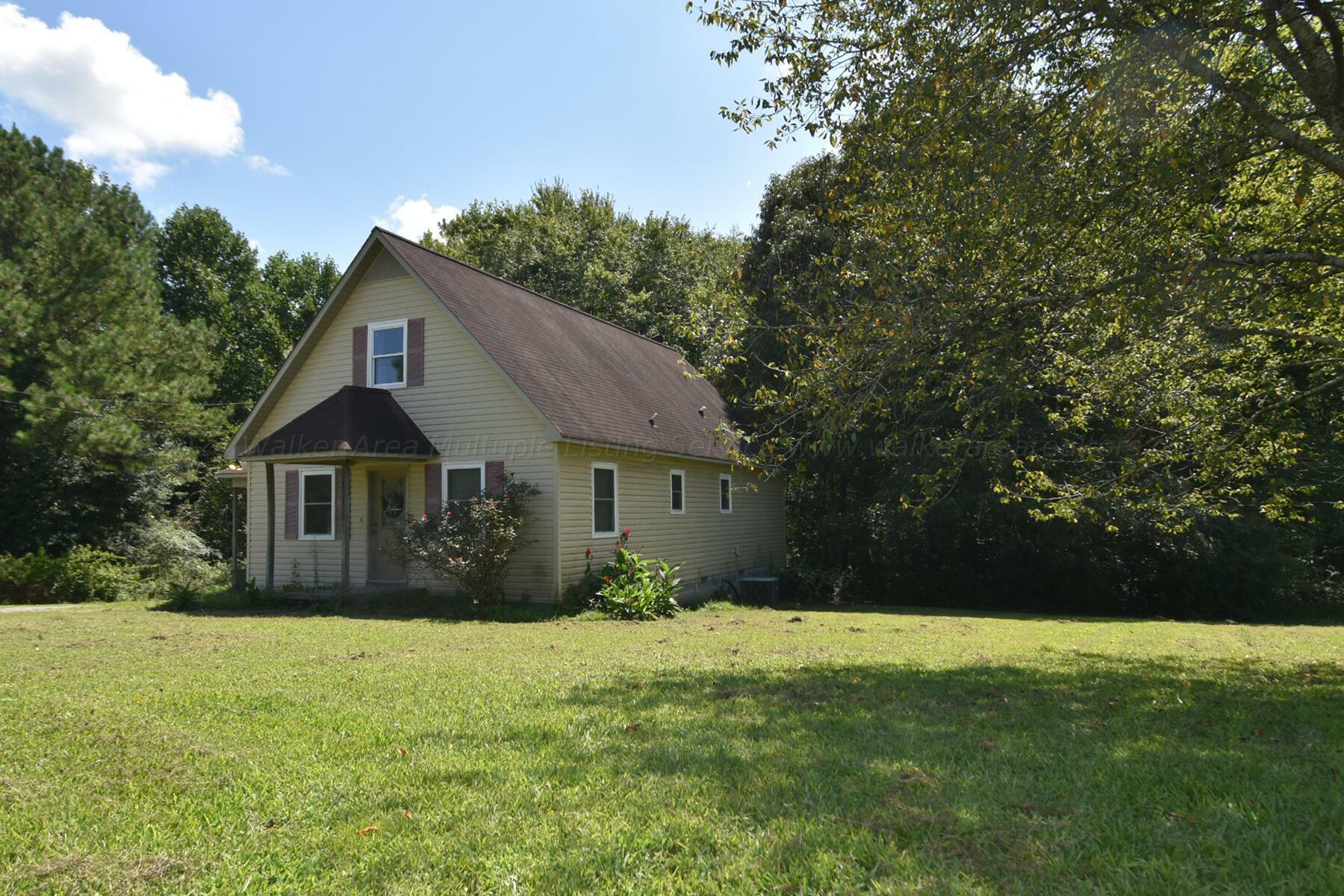 Property Photo:  100 County Rd 1125  AL 35179 