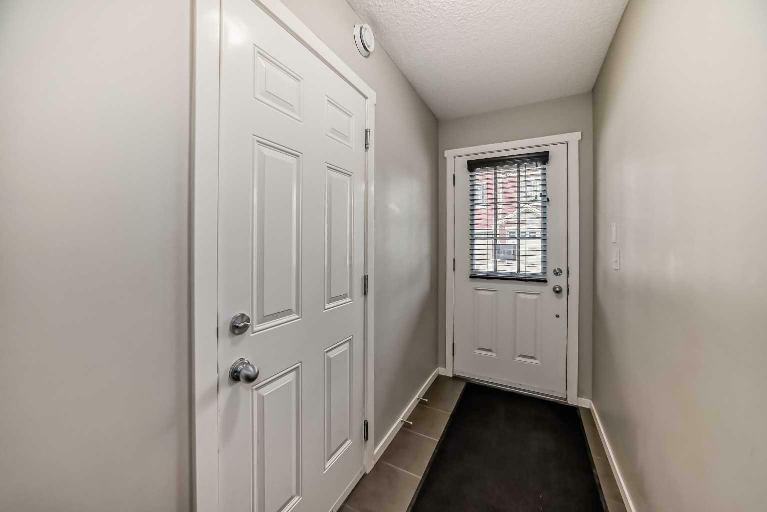 Property Photo:  125 Panatella Way NW 1610  AB T3K 0R9 