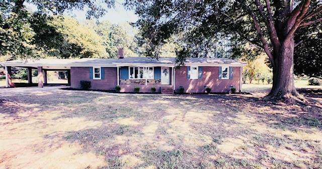 Property Photo:  201 Rocky River Road  NC 28129 