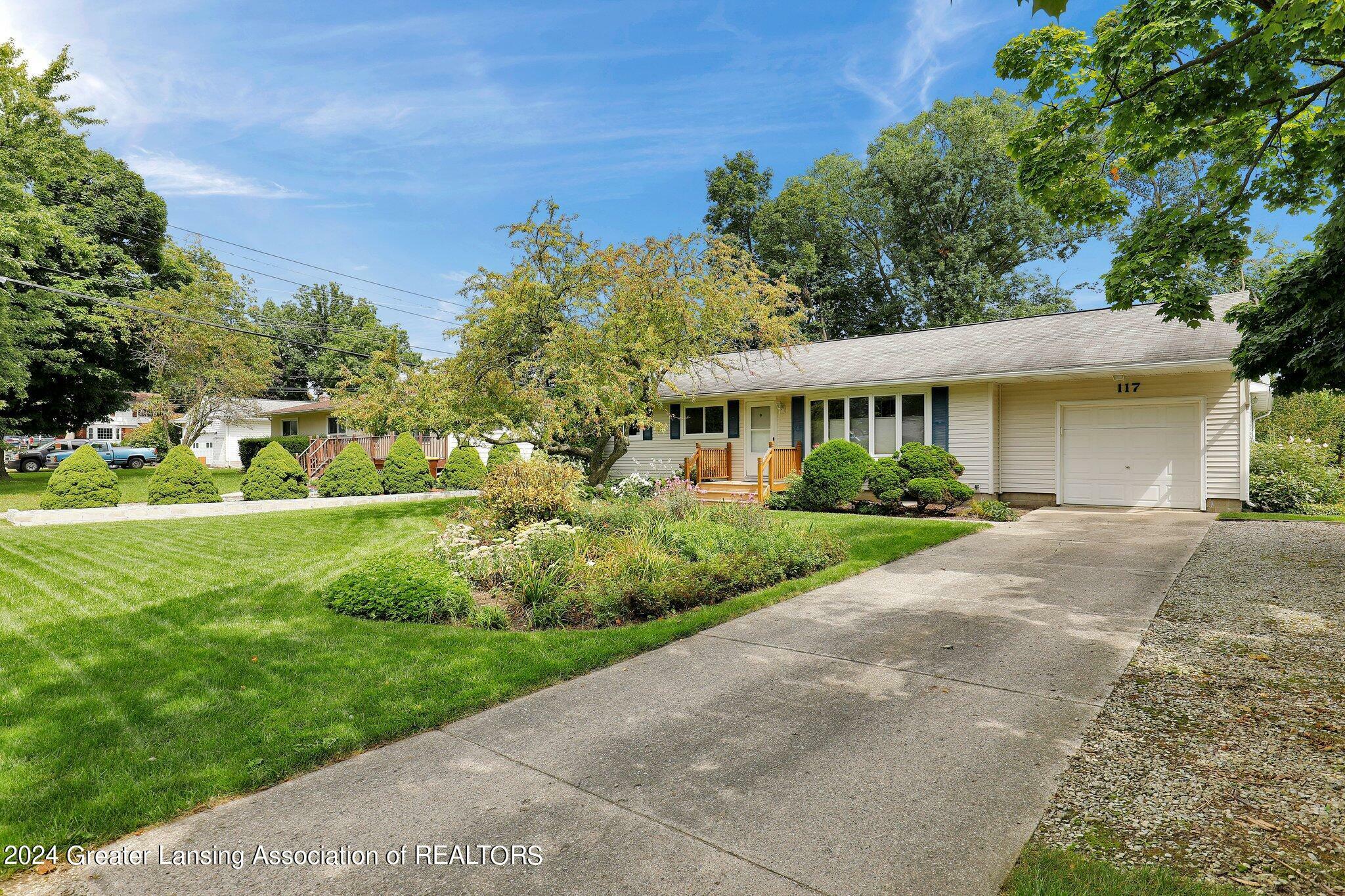 Property Photo:  117 Woodhaven Drive  MI 48917 