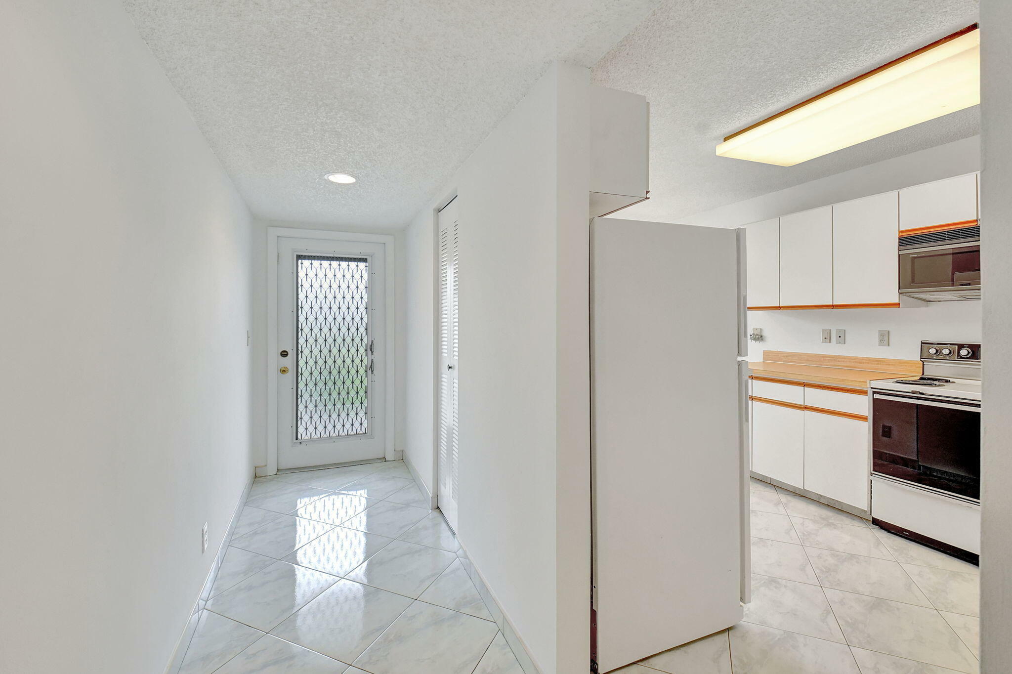 Property Photo:  5598 Witney Drive 305  FL 33484 