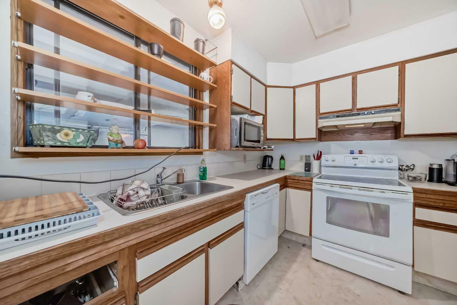 Property Photo:  1030 Rundleview Drive  AB T1W 2P2 