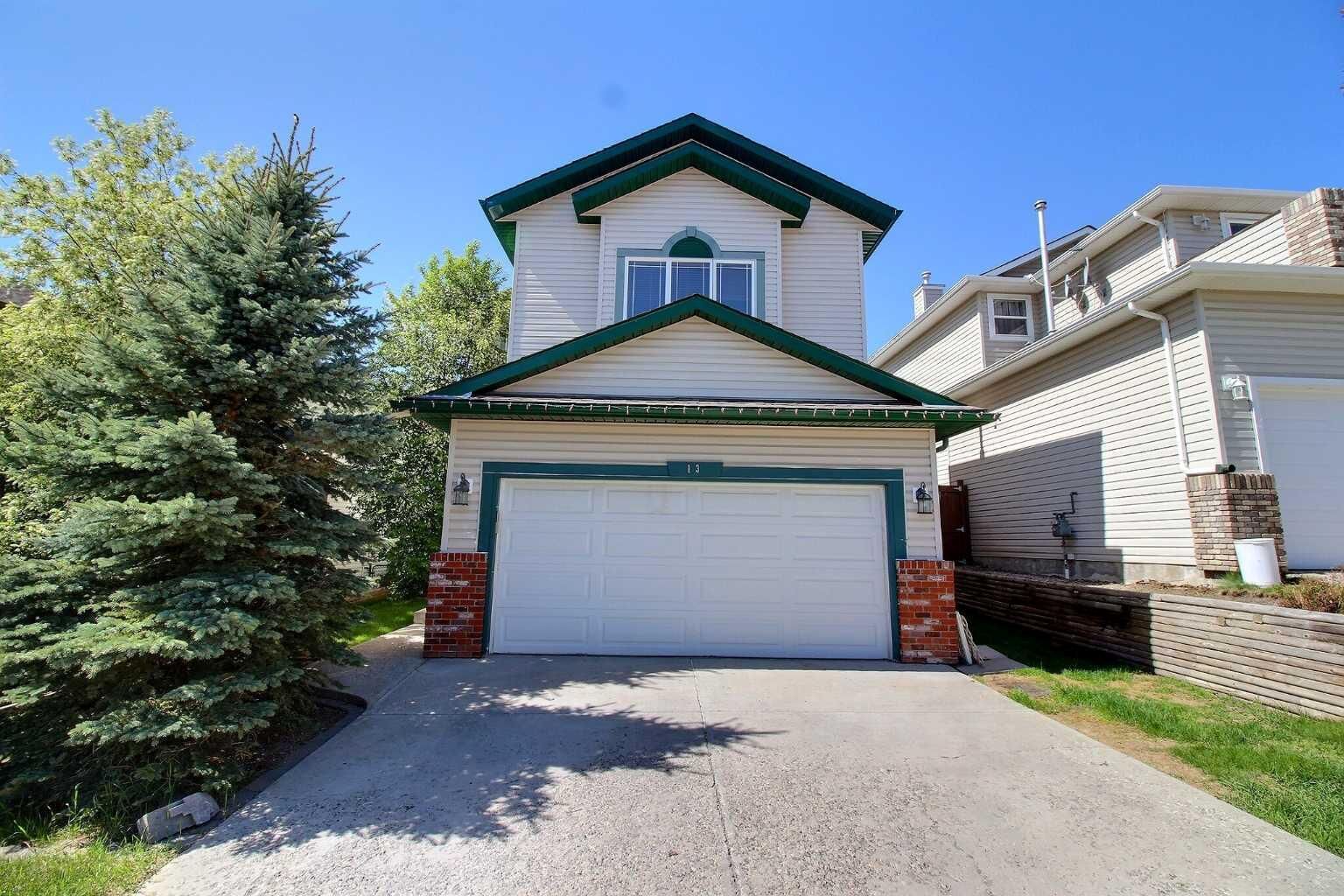 Property Photo: 13 Bow Ridge Drive AB T4C 1V6