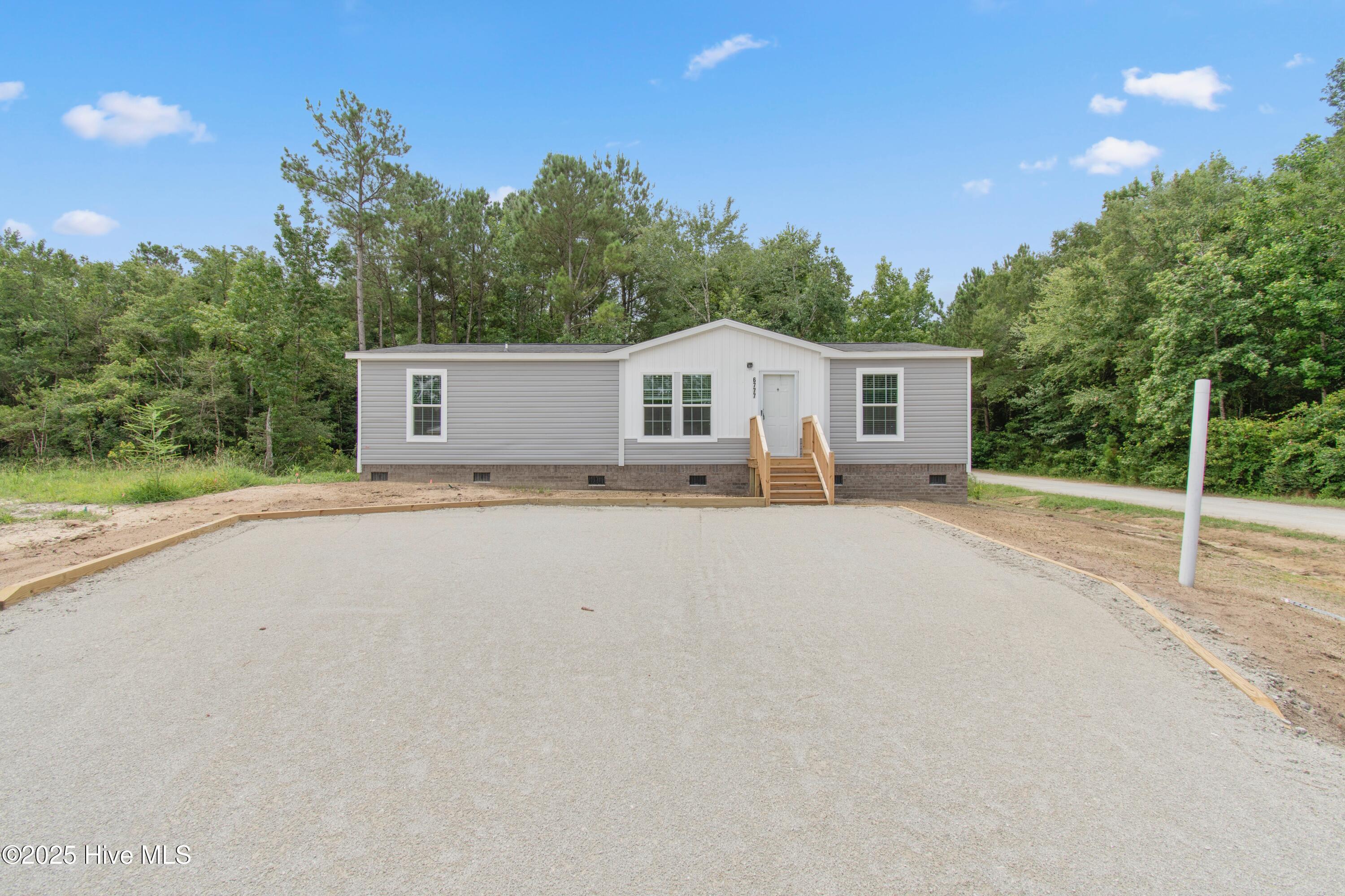 Property Photo:  6777 Lewis Drive SE  NC 28479 