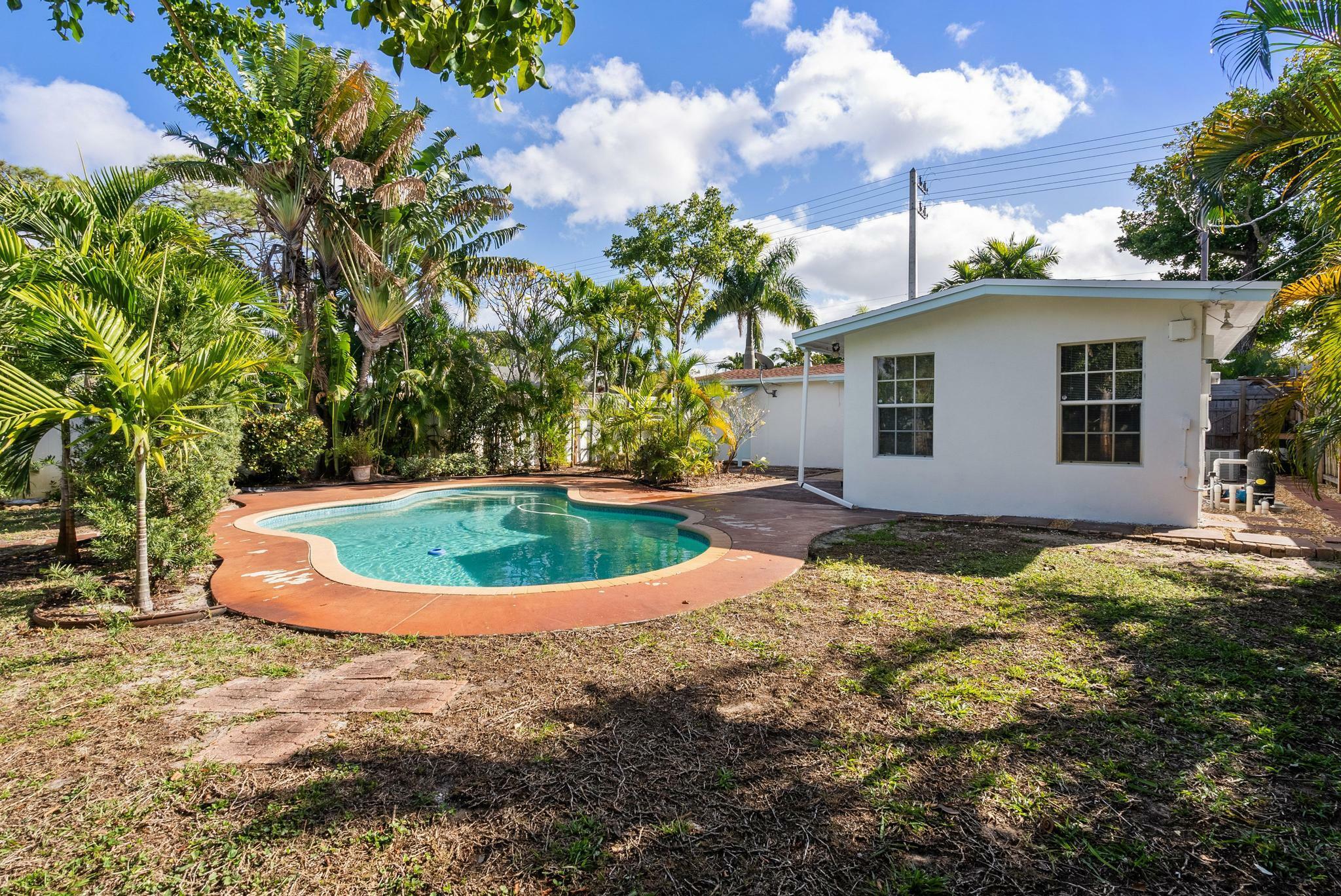 Property Photo:  1399 NE 38th Street  FL 33334 