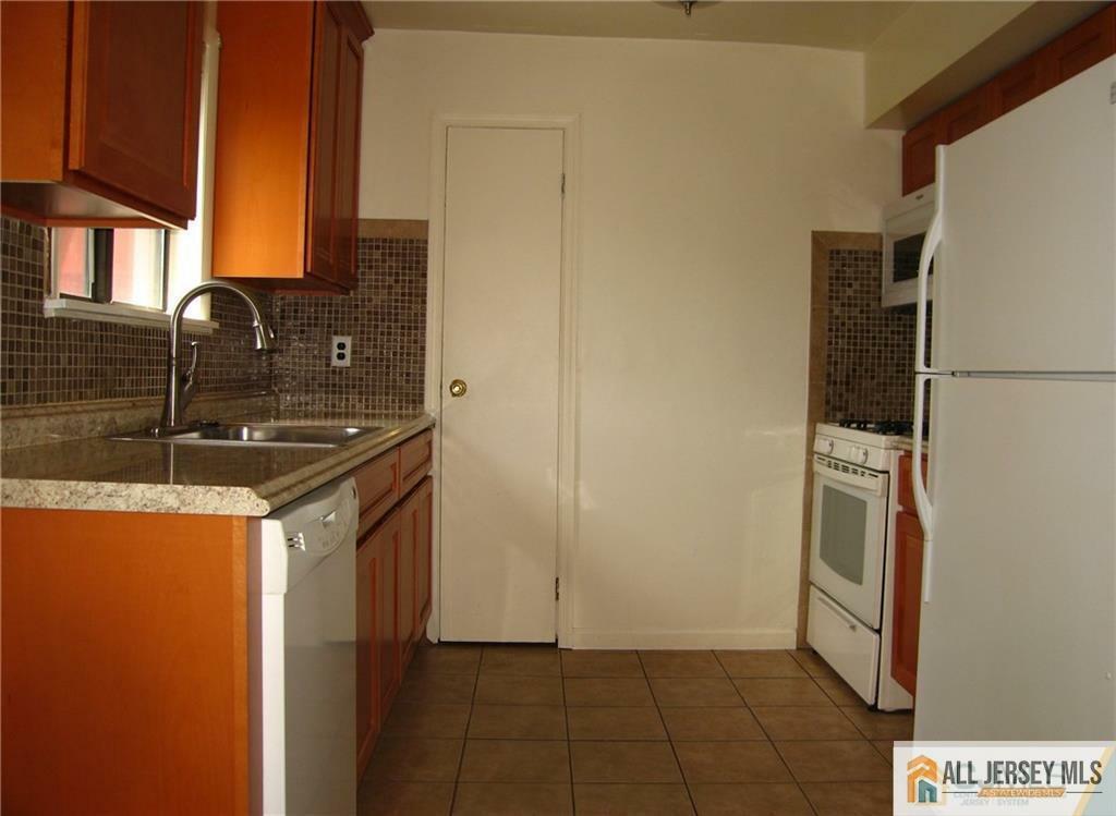 Property Photo:  1208 N Oaks Boulevard 08  NJ 08902 