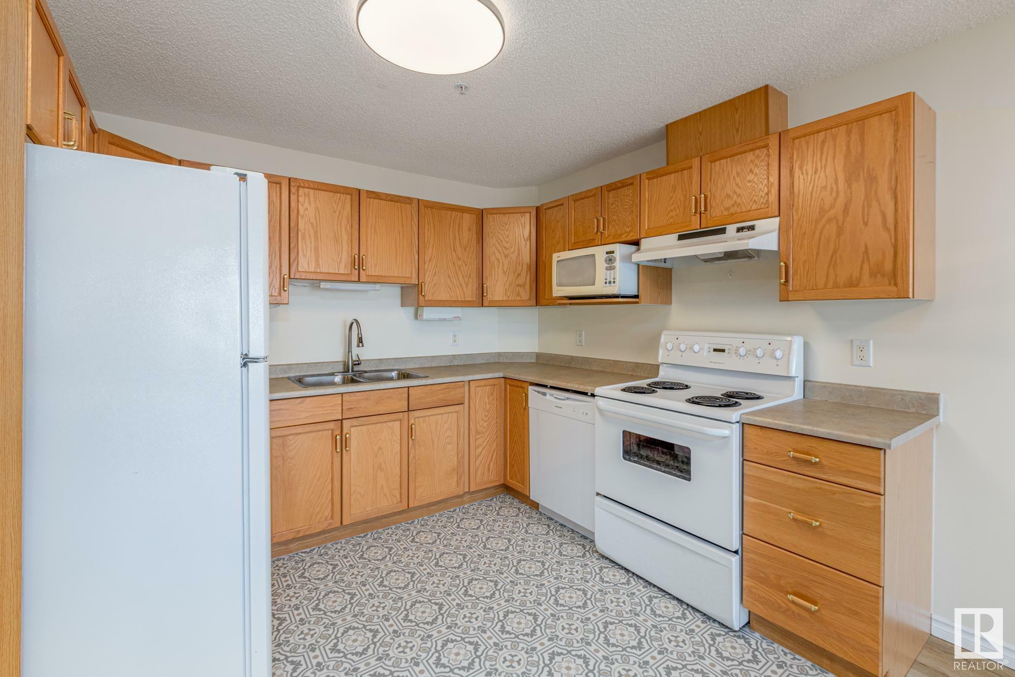 Property Photo:  2741 55 Street NW 336  AB T6L 7G7 