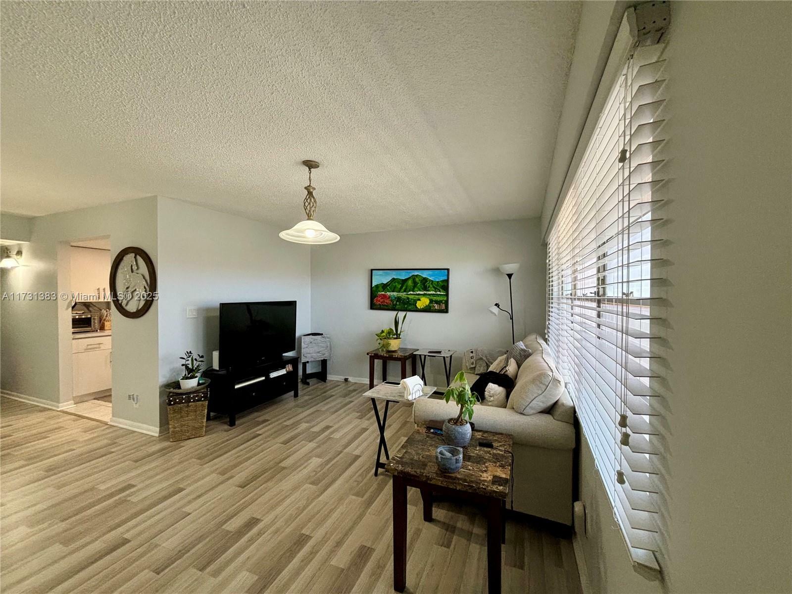 Property Photo:  801 SW 133rd Ter 415K  FL 33027 