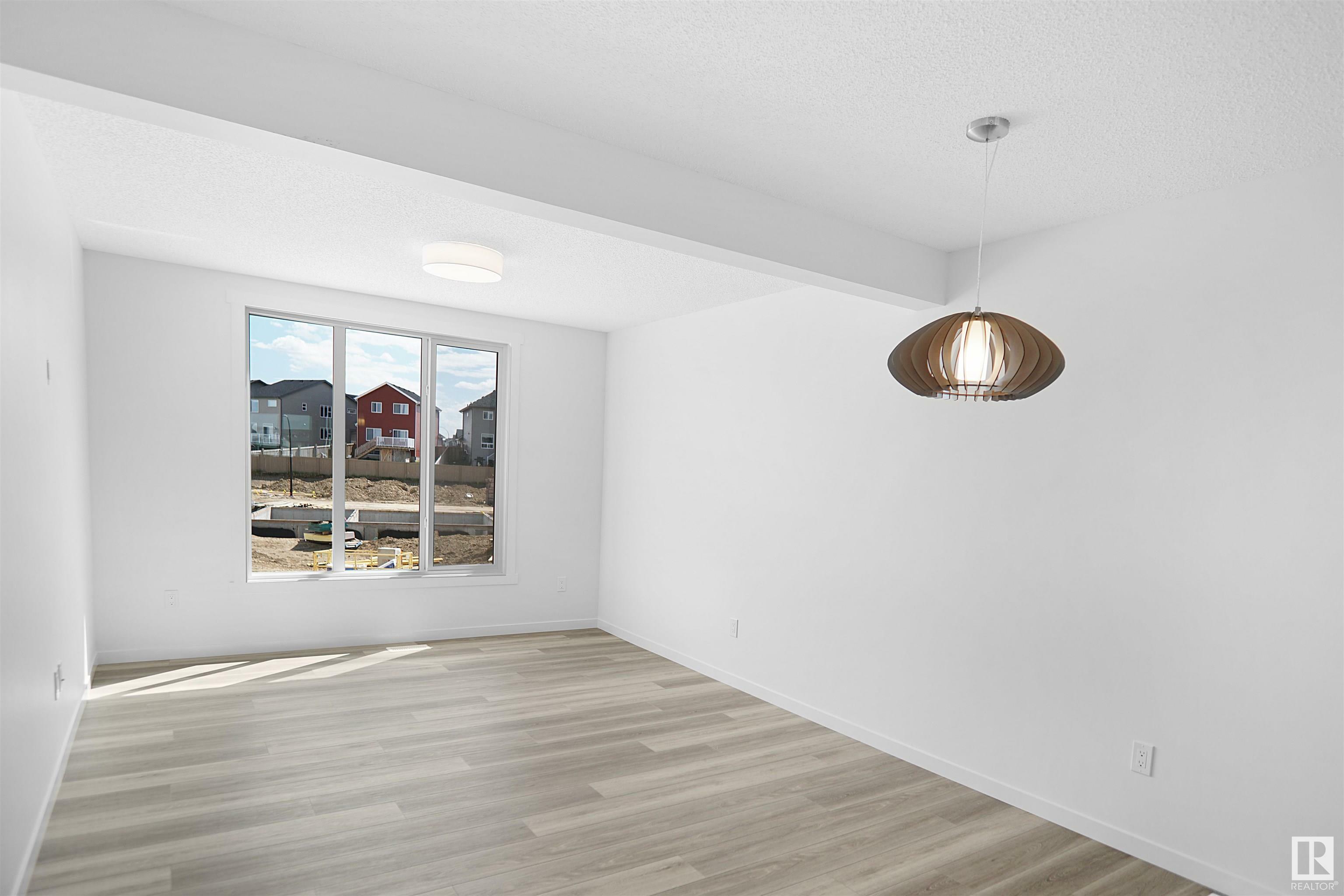 Property Photo: 1025 Secord Promenade NW 136 AB T5T 7V4