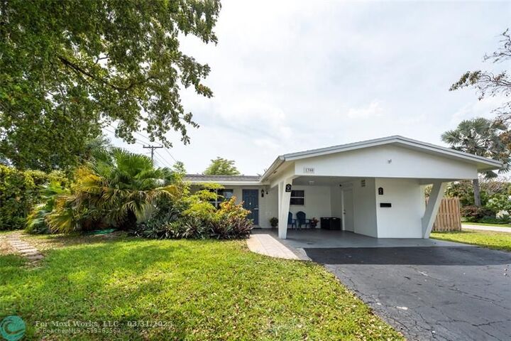 Property Photo:  1300 NE 47th Ct  FL 33334 
