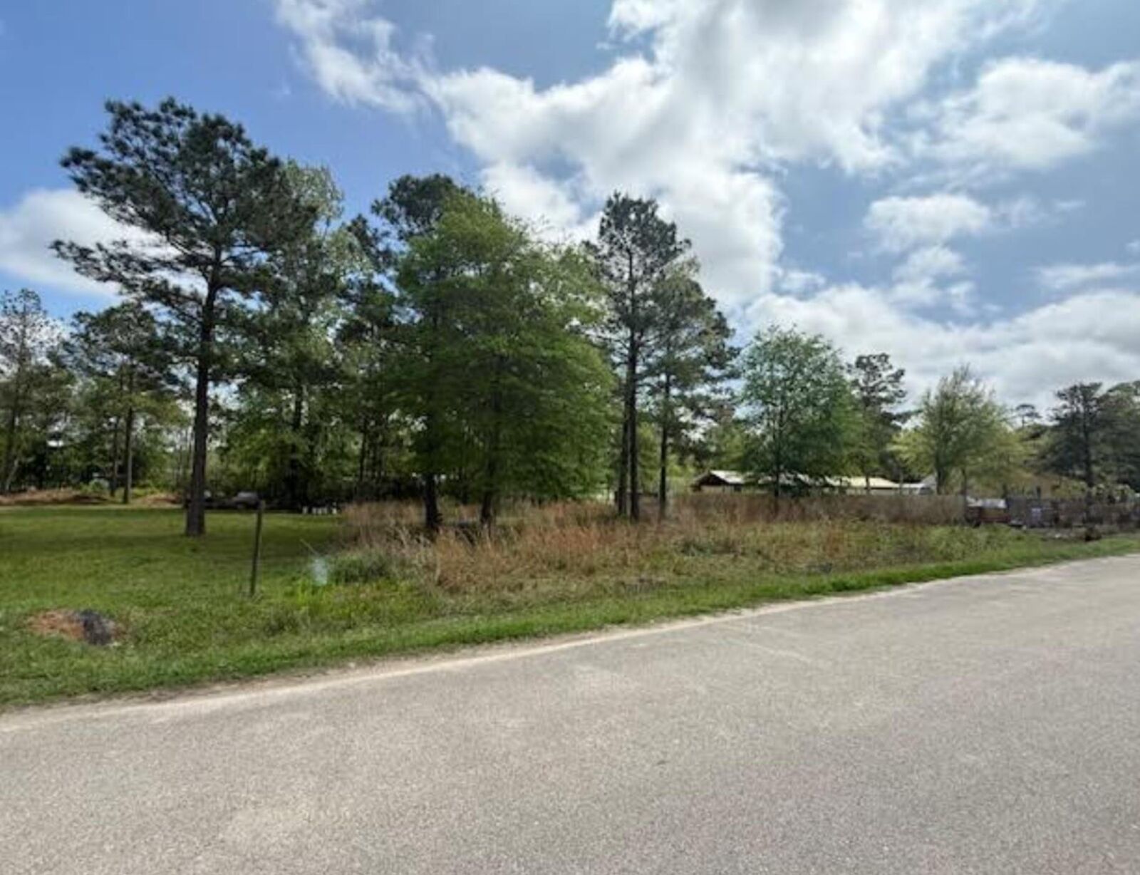 Property Photo: 305 County Road 3419 TX 77327