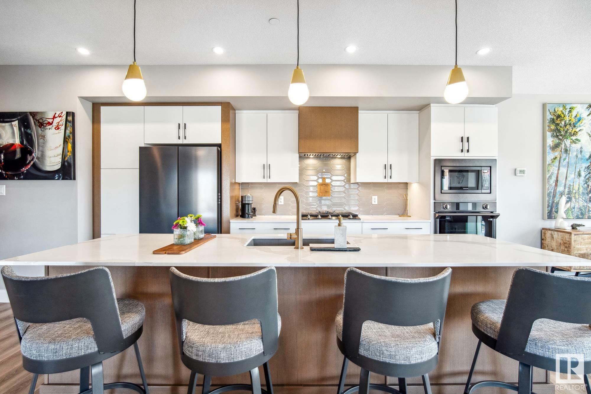 Property Photo: 7463 May Common NW 418 AB T6R 0X1