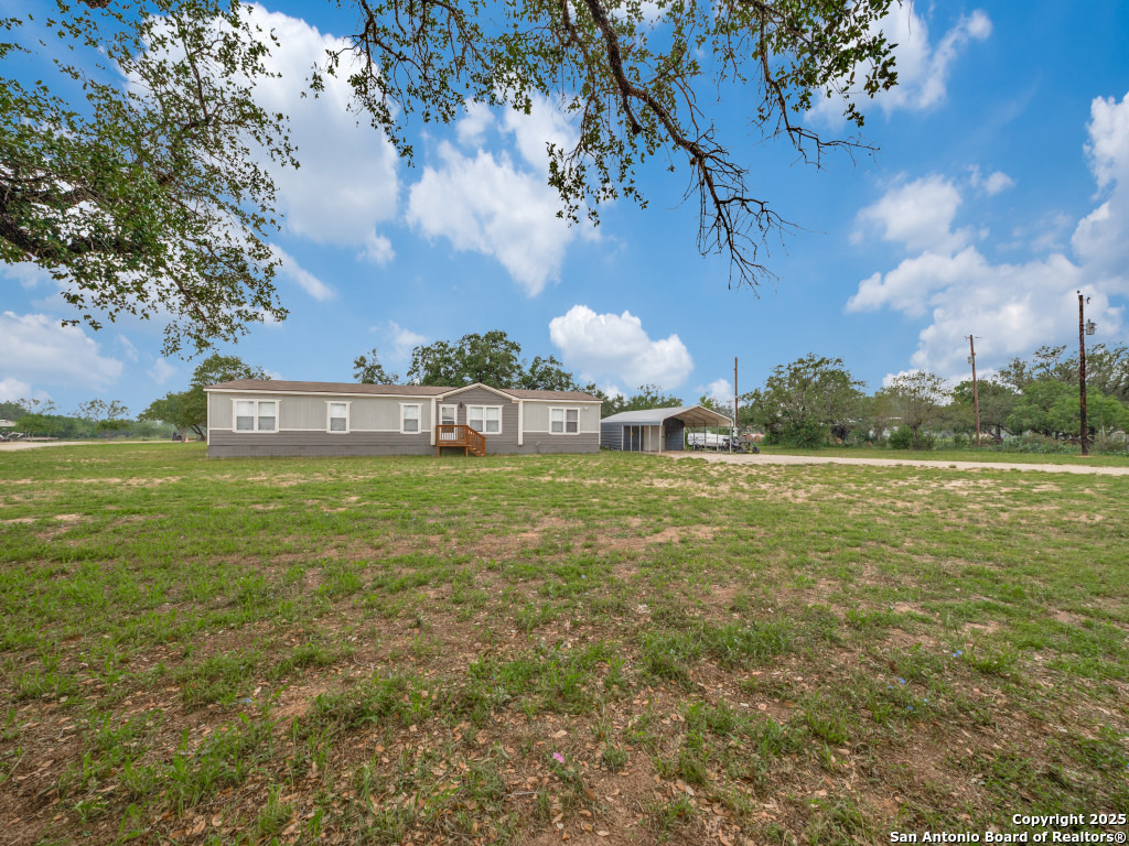 Property Photo: 1192 County Road 777 TX 78016
