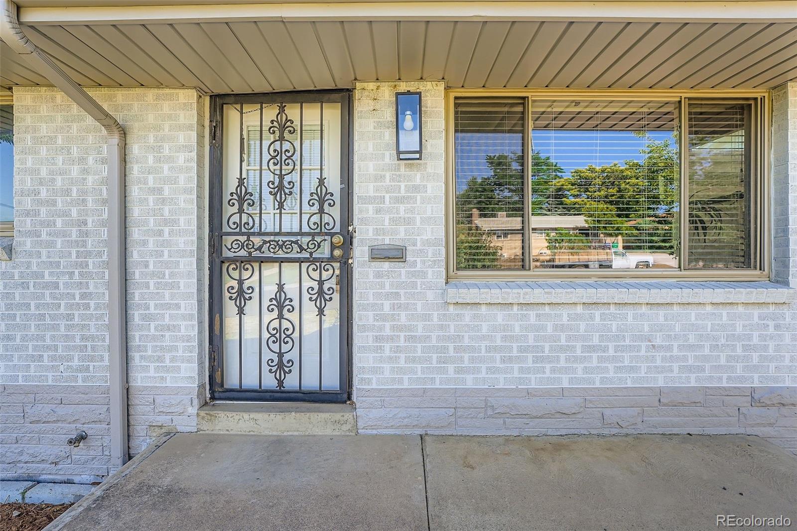 Property Photo:  1926 S Yates Street  CO 80219 