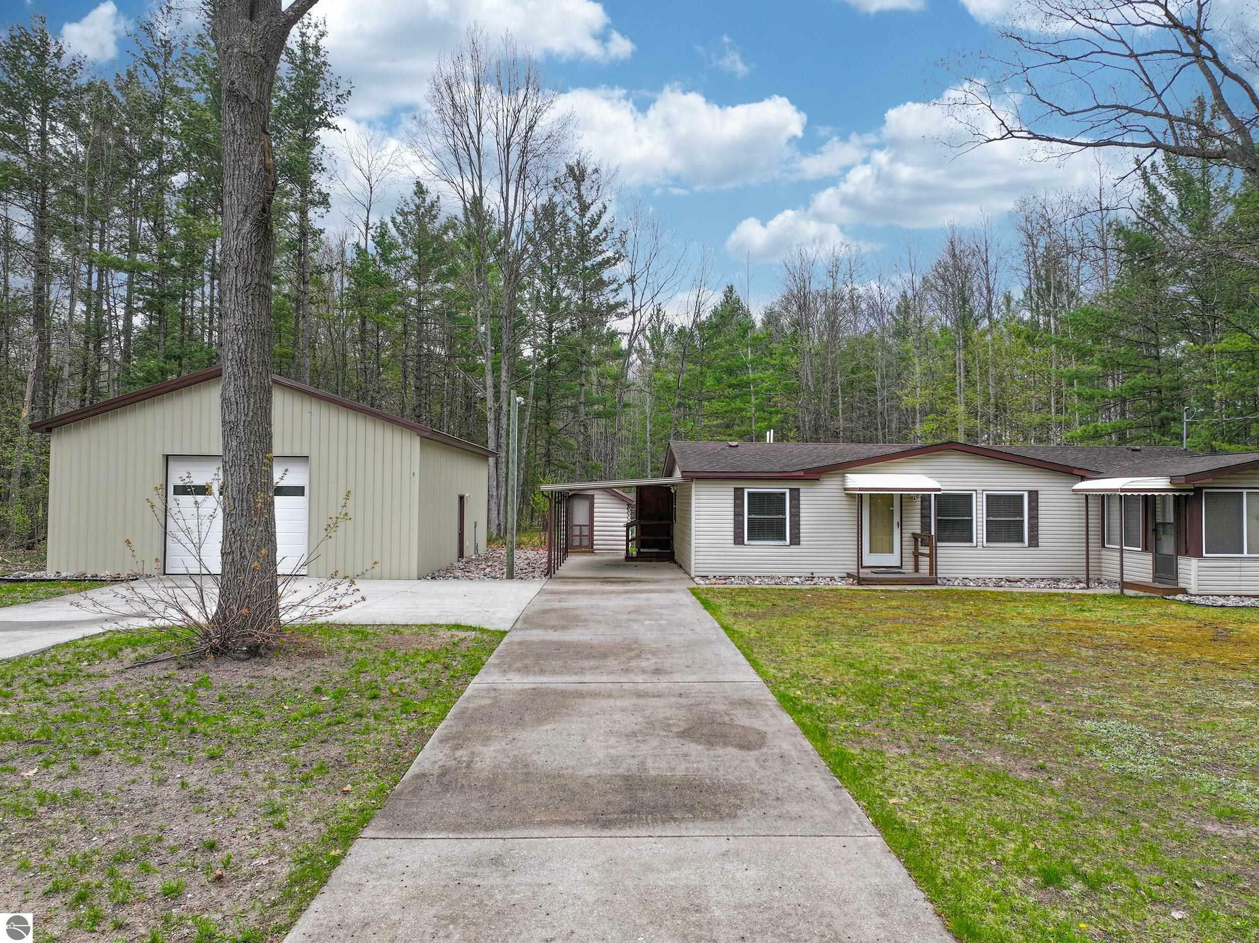 Property Photo:  2755 NE Log Lake Road  MI 49646 
