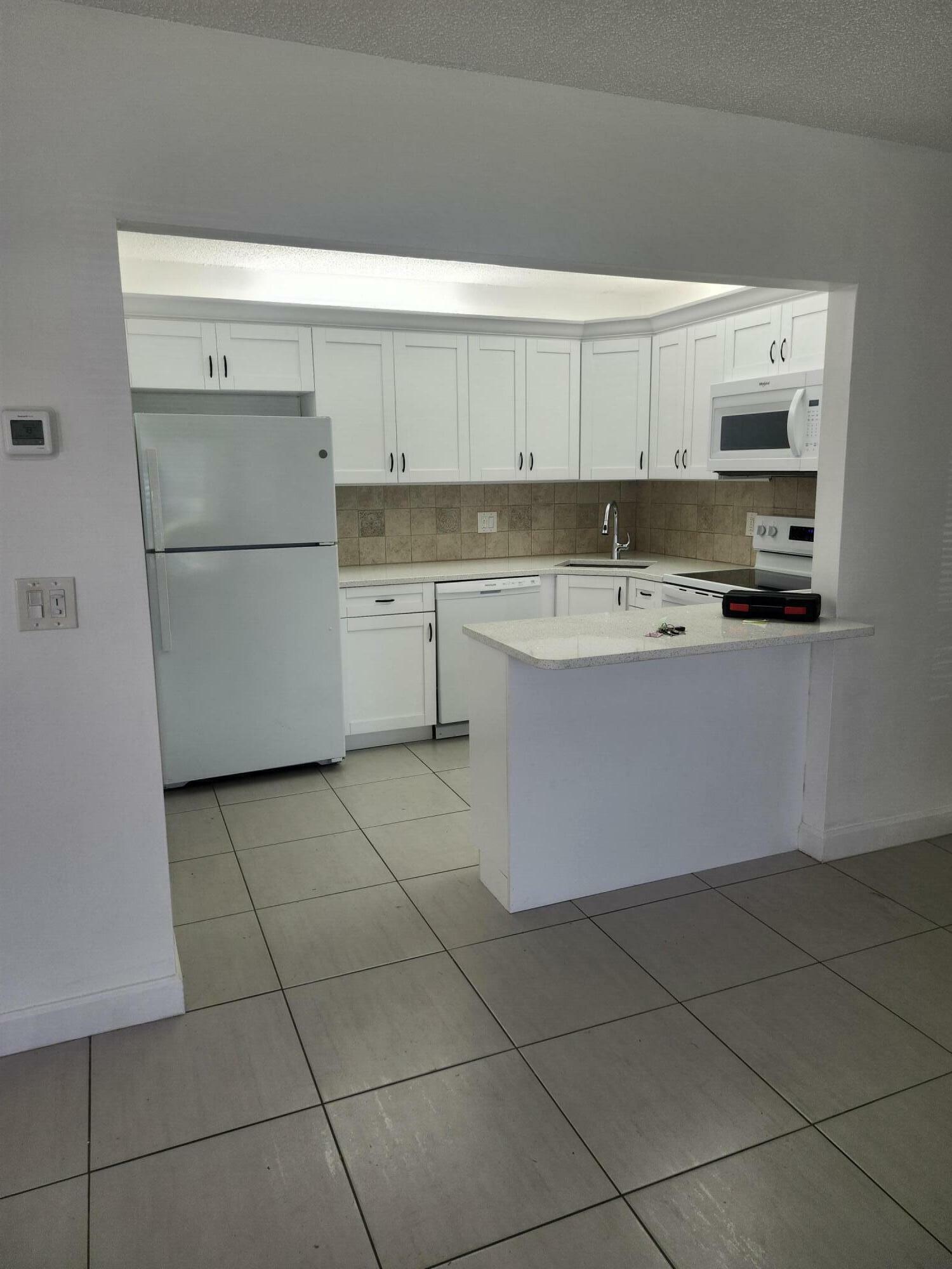 Property Photo:  3587 La Playas Court A-1  FL 33463 