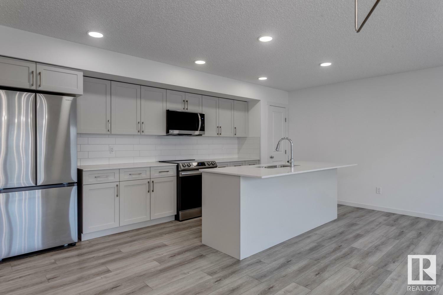 Property Photo: 905 172 Street SW 33 AB T6W 5L8