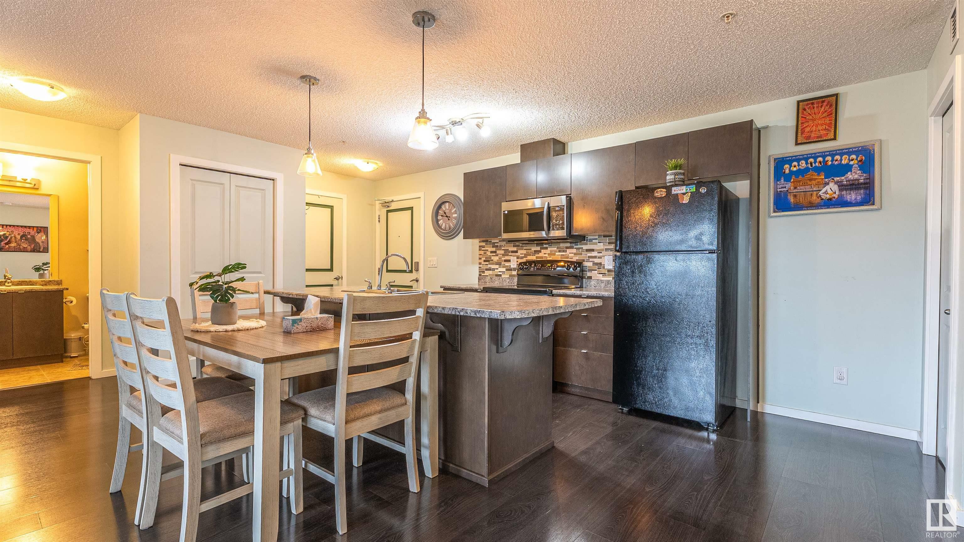 Property Photo: 3357 16A Avenue NW 222 AB T6J 2J1