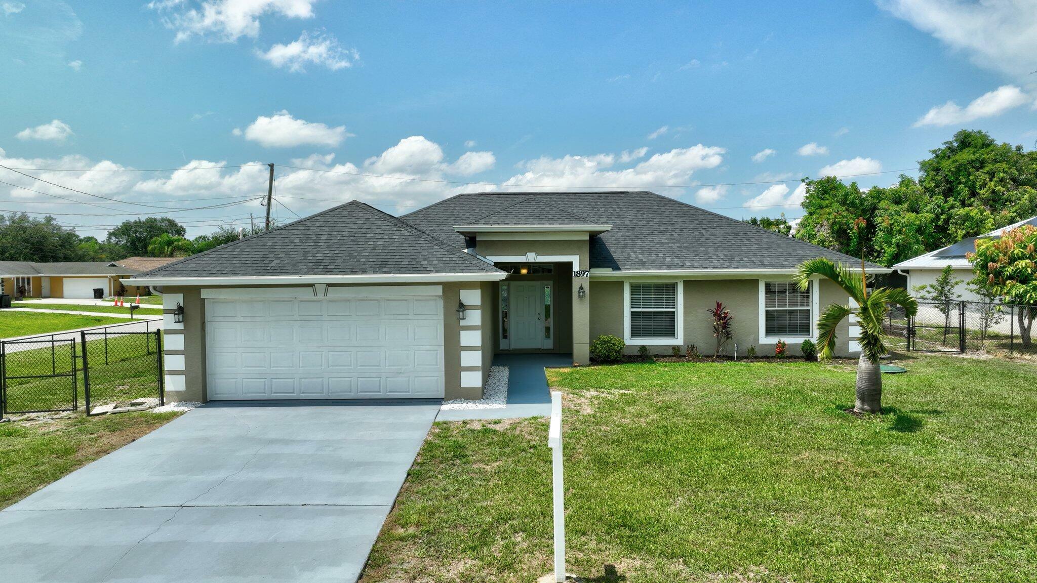Property Photo: 1897 SW Lofgren Avenue FL 34953