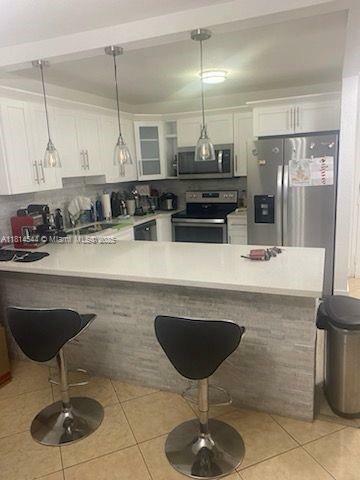Property Photo: 6990 NW 186th St 4-409 FL 33015