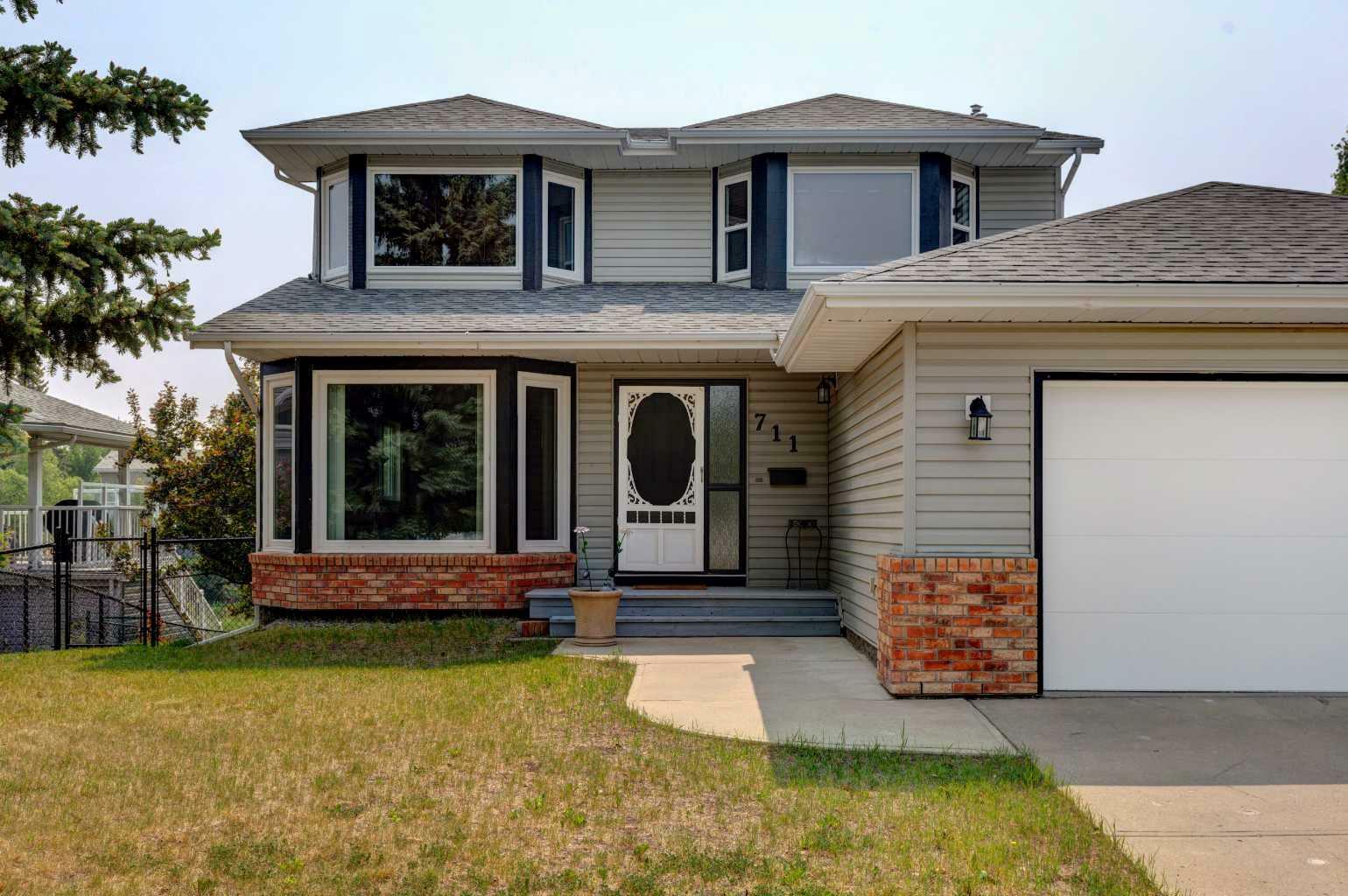 Property Photo: 711 High Country Drive NW AB T1V 1E3