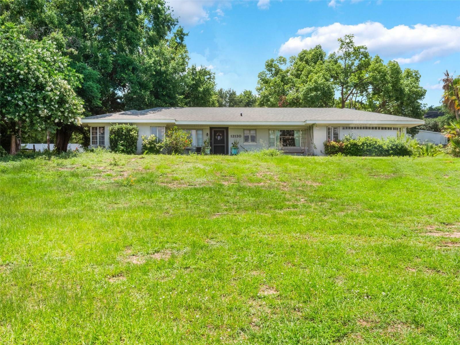 Property Photo: 12130 Lakeshore Drive FL 34711