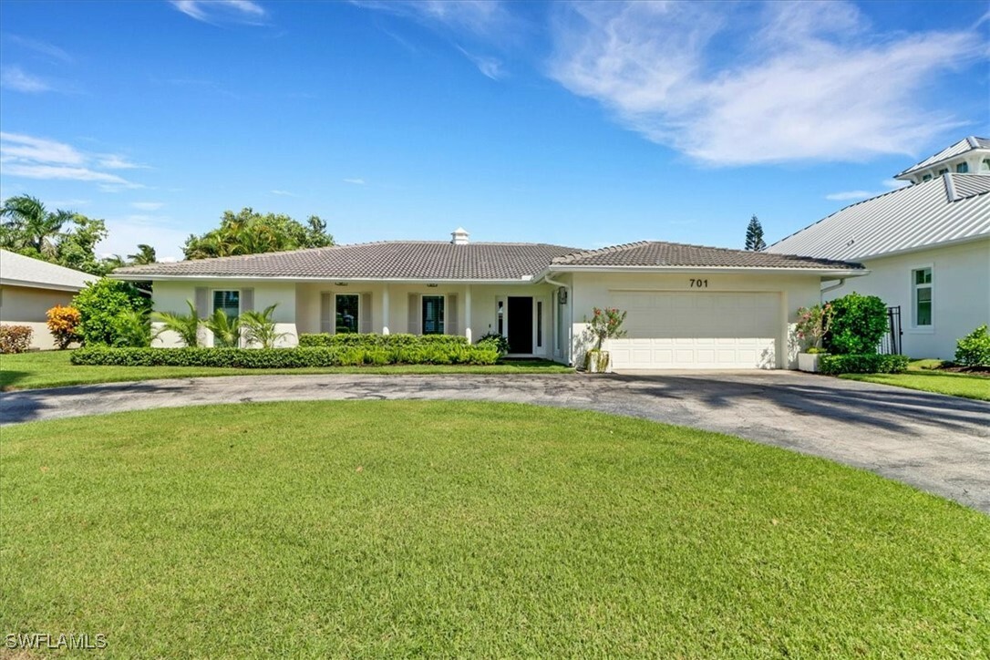 Property Photo:  701 Harbour Drive  FL 34103 
