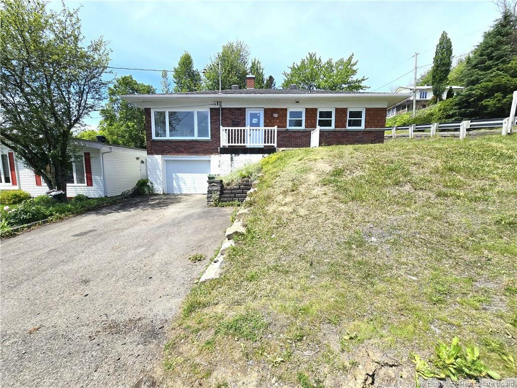 Property Photo:  18 23E Avenue  NB E3V 2G5 