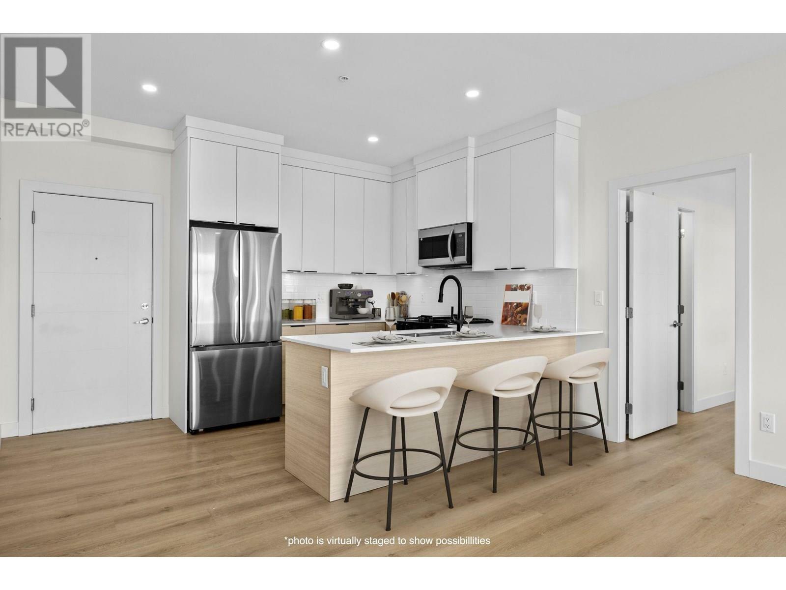 Property Photo: 5300 Main Street 203 BC V1W 0C1