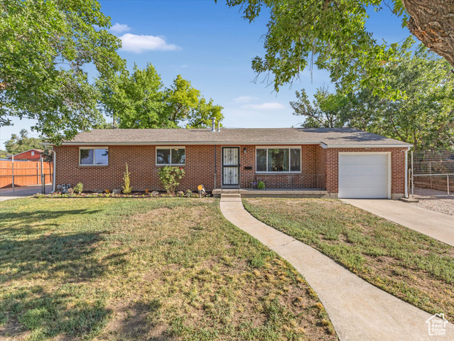 Property Photo: 7645 W Gardenia Ave UT 84044