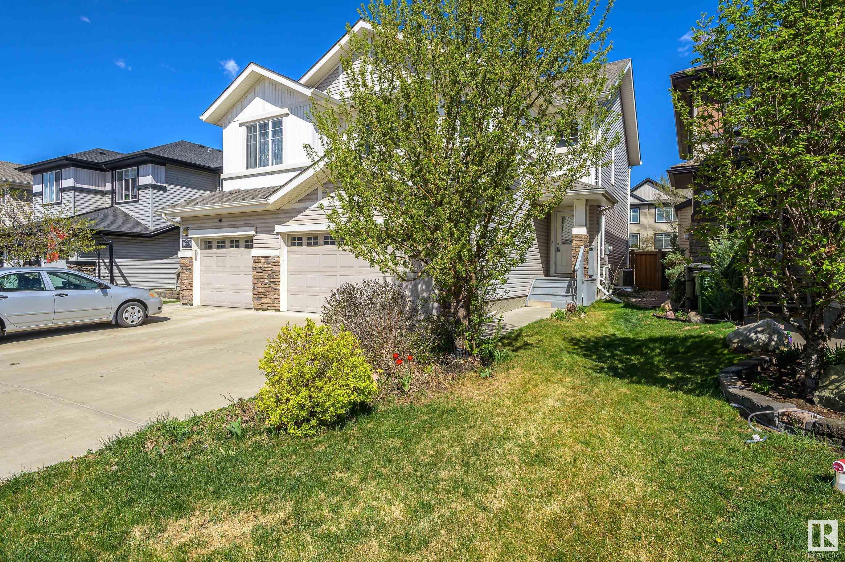 Property Photo: 1684 Cunningham Way SW AB T6W 0W5