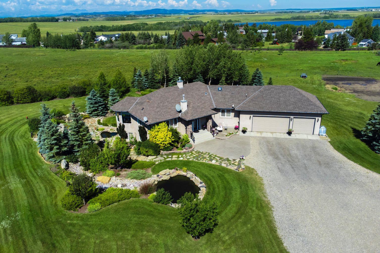Property Photo:  42210 Cochrane Lake W  AB T4C 2B1 