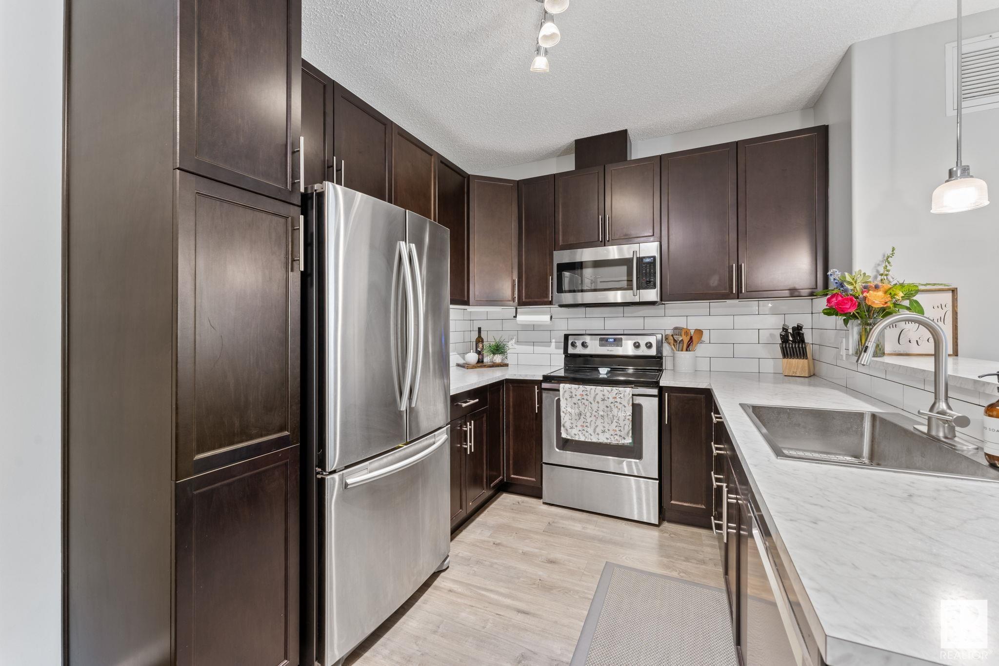 Property Photo: 7825 71 Street NW 244 AB T6B 3R9