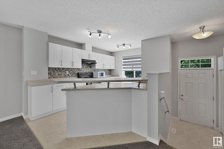 Property Photo: 465 Hemingway Road NW 133 AB T6M 0J7