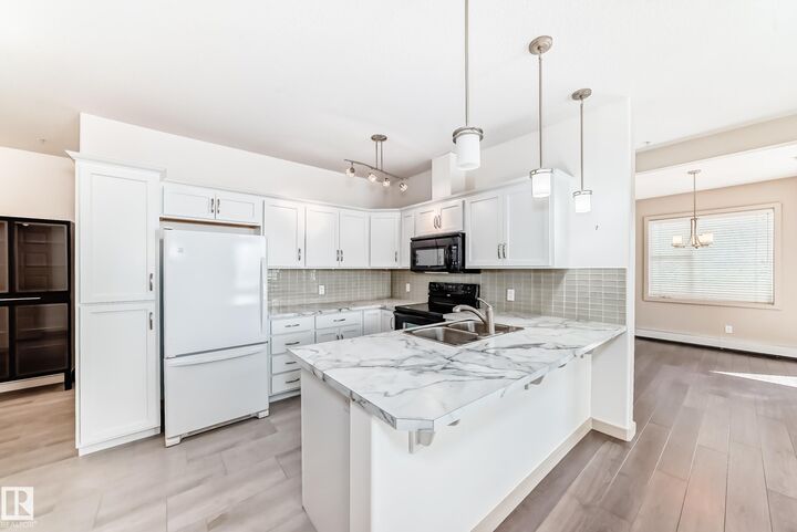 Property Photo: 304 Ambleside Link SW 202 AB T6W 0V2