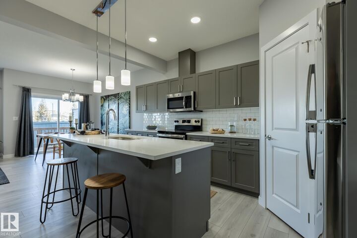 Property Photo:  10718 99 Street  AB T8R 2R8 