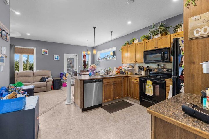 Property Photo: 4546 Iron Wolf Place 8 AB T4L 0G1