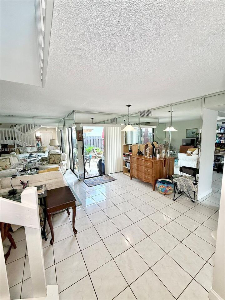 Property Photo:  11028 SW 132nd Pl 24-4  FL 33186 