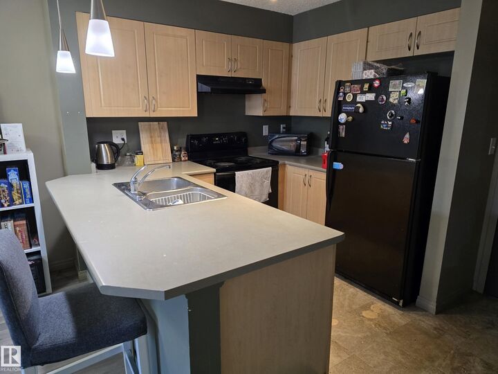 Property Photo: 11441 Ellerslie Road SW 403 AB T6W 1S9
