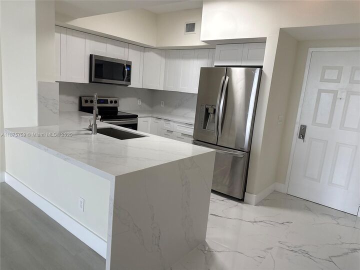 Property Photo:  888 S Douglas Rd 1502  FL 33134 