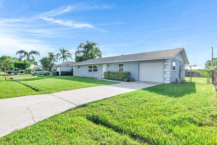 Property Photo: 2458 SW Hinchman Street FL 34984